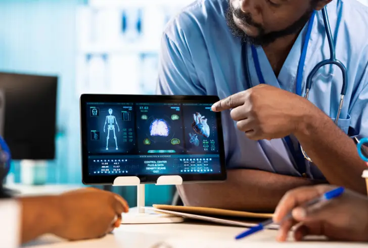 Doctor reviewing AI body scan data